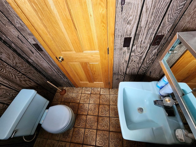 W11635 Lake St, Naubinway, MI 49762 - half bathroom with toilet and tile patterned floors
