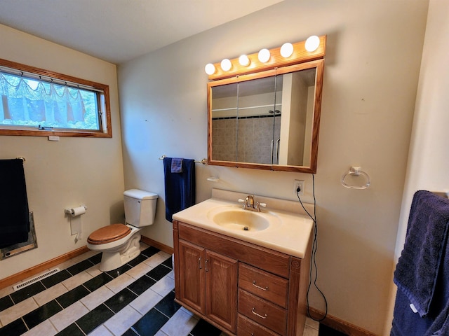 W11635 Lake St, Naubinway, MI 49762 - full bathroom featuring vanity, toilet, tile patterned floors, baseboards, and a shower