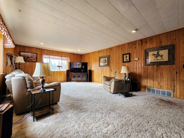 W11635 Lake St, Naubinway, MI 49762 - living area with wooden walls, carpet, and visible vents