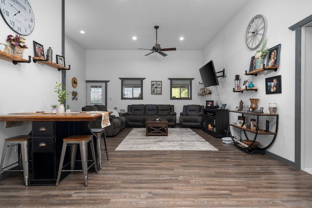 living room with recessed lighting, dark wood finished floors, and ceiling fan