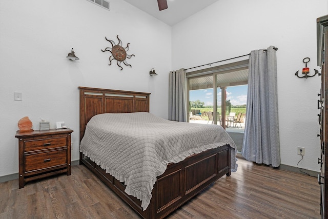 bedroom featuring access to outside, ceiling fan, dark wood finished floors, and visible vents