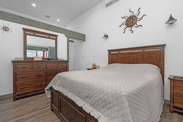 bedroom with recessed lighting, dark wood finished floors, and visible vents