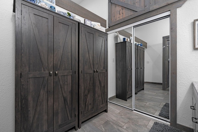 interior space with a storage unit and an outdoor structure