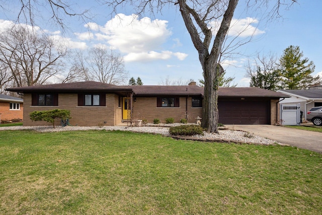 single story home with concrete driveway, brick siding, a front yard, and a garage