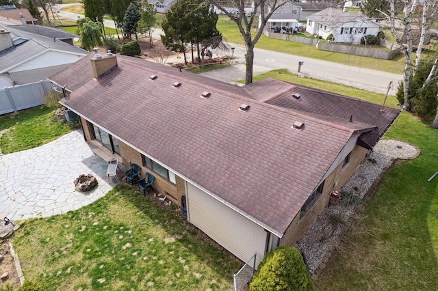 birds eye view of property with a residential view