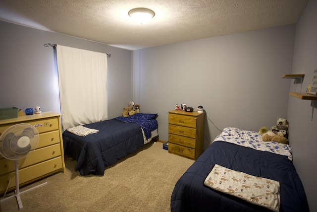 carpeted bedroom with a textured ceiling