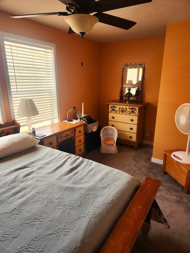 carpeted bedroom featuring a ceiling fan