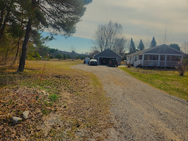 view of road featuring gravel driveway