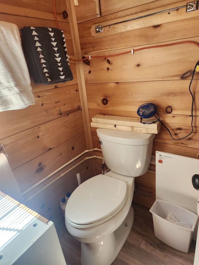 bathroom with wood finished floors and toilet