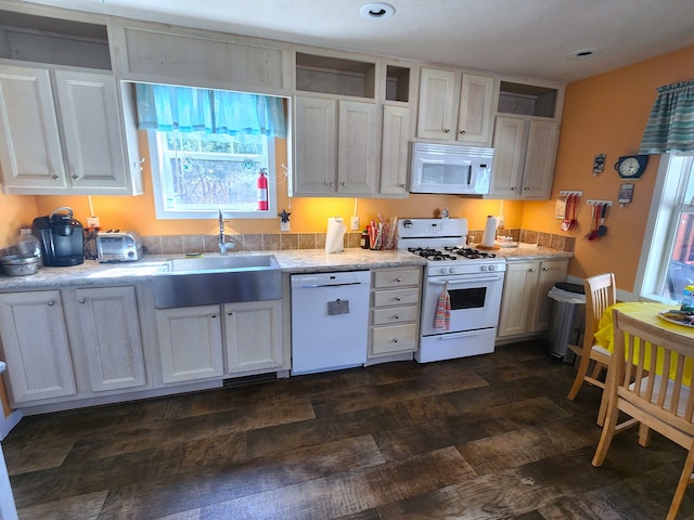 kitchen featuring white cabinets, open shelves, a sink, white appliances, and light countertops