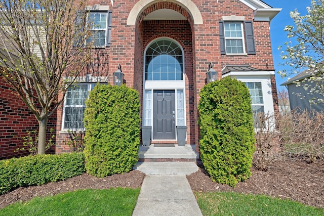 entrance to property with brick siding