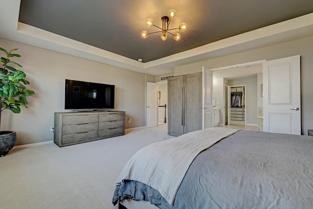 bedroom with carpet flooring, baseboards, and a notable chandelier
