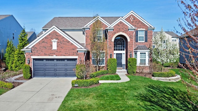 traditional-style home with brick siding, an attached garage, driveway, and a front lawn