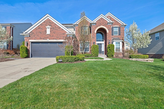 traditional home with concrete driveway, a front yard, and brick siding