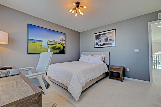 carpeted bedroom featuring baseboards and visible vents