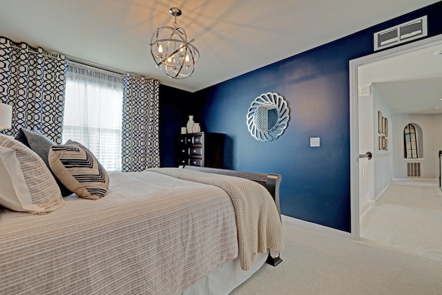 bedroom with carpet floors, a notable chandelier, baseboards, and visible vents