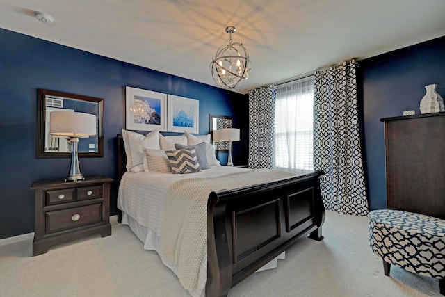 bedroom featuring light carpet and a chandelier