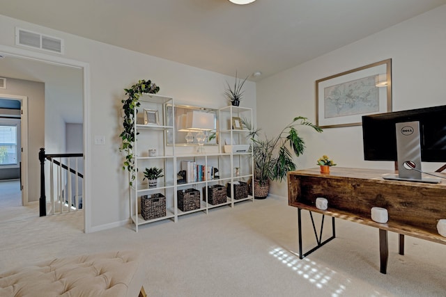 carpeted home office with baseboards and visible vents