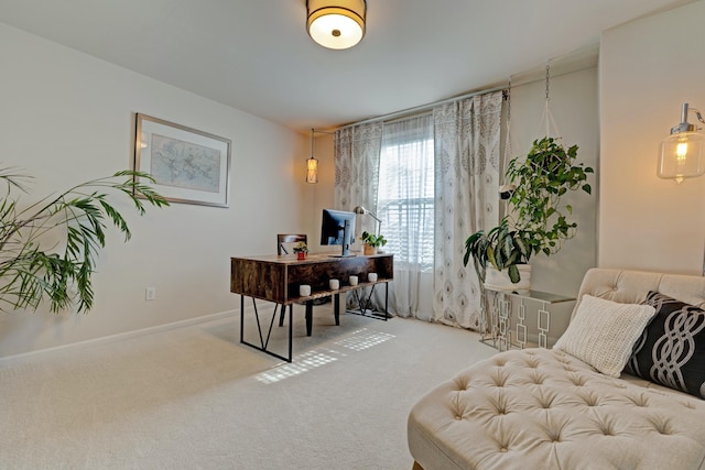 carpeted home office with baseboards