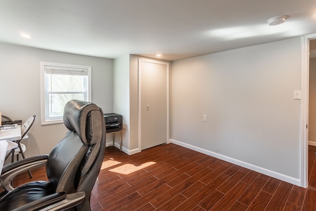 office space with baseboards, recessed lighting, and dark wood-type flooring