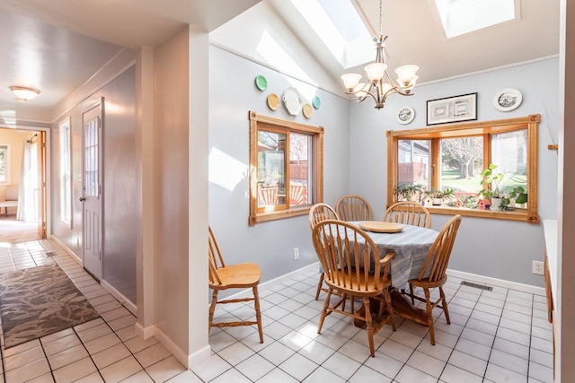 dining room with light tile patterned floors, visible vents, ornamental molding, and a notable chandelier