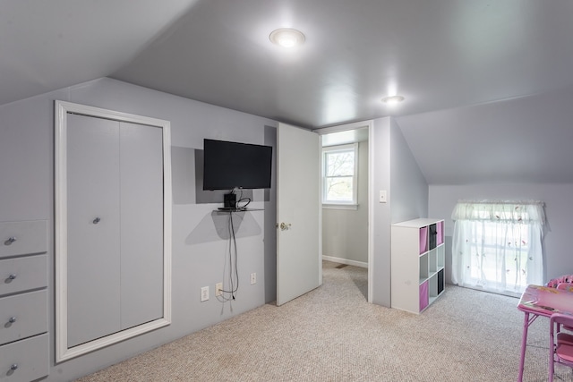 interior space featuring vaulted ceiling