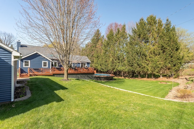 view of yard with a wooden deck