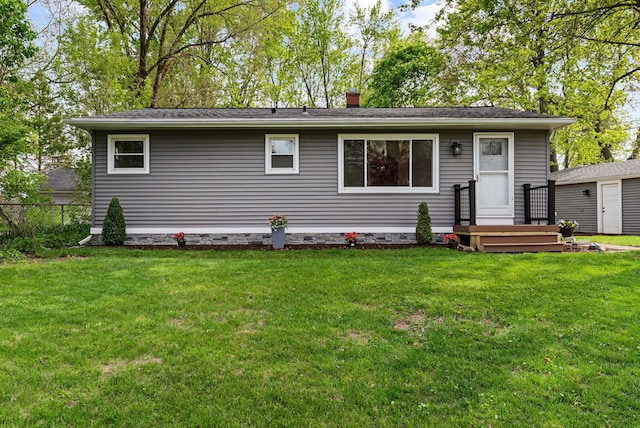 5857 Berkley Dr, Waterford, MI 48327 - back of property featuring a chimney, an outdoor structure, crawl space, and a storage shed