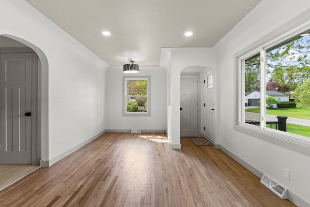 5857 Berkley Dr, Waterford, MI 48327 - entrance foyer with healthy amount of natural light, light wood-style flooring, baseboards, and recessed lighting