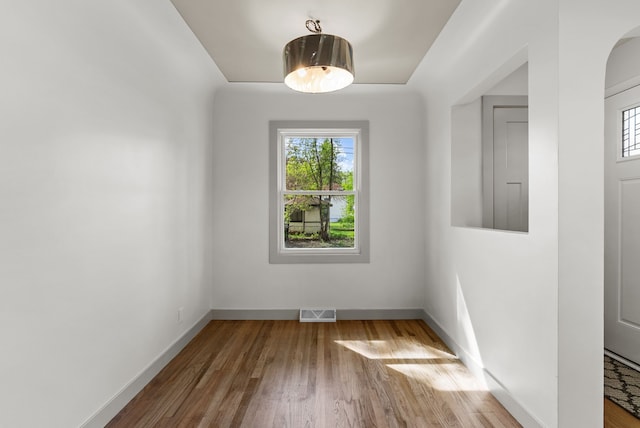 5857 Berkley Dr, Waterford, MI 48327 - spare room featuring healthy amount of natural light, wood finished floors, and baseboards