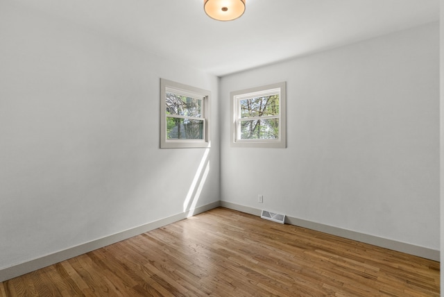 5857 Berkley Dr, Waterford, MI 48327 - unfurnished room featuring wood finished floors and baseboards