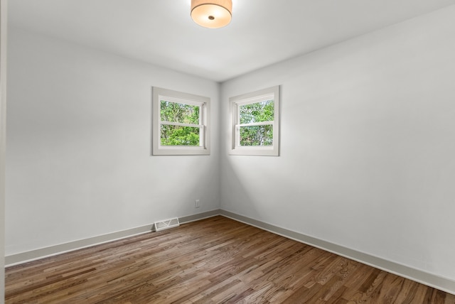 5857 Berkley Dr, Waterford, MI 48327 - unfurnished room featuring wood finished floors and baseboards