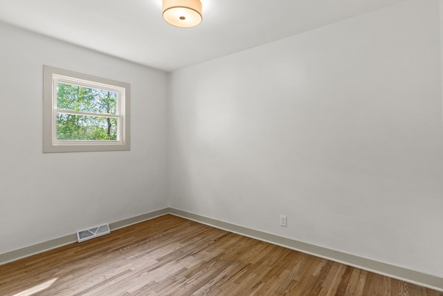 5857 Berkley Dr, Waterford, MI 48327 - spare room featuring baseboards and light wood-style flooring