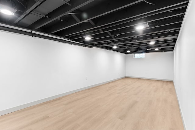 5857 Berkley Dr, Waterford, MI 48327 - basement featuring wood finished floors and baseboards