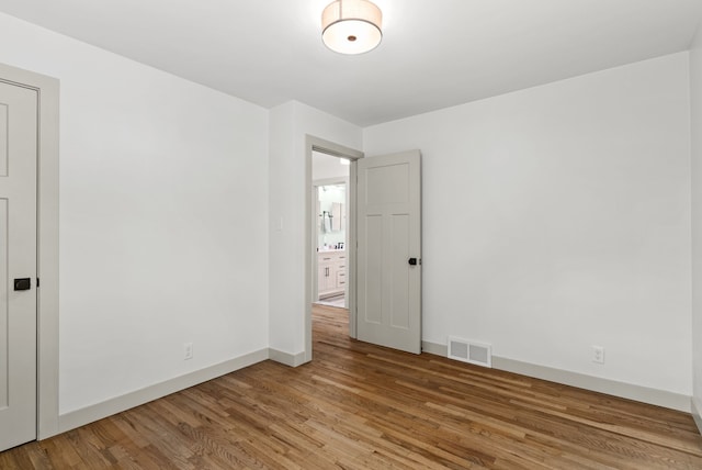 5857 Berkley Dr, Waterford, MI 48327 - unfurnished room featuring wood finished floors and baseboards