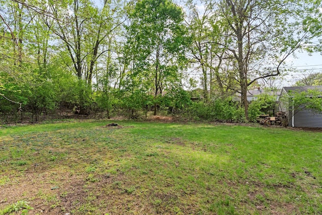 5857 Berkley Dr, Waterford, MI 48327 - view of green lawn featuring an outbuilding