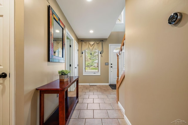 doorway to outside with recessed lighting, baseboards, and tile patterned flooring