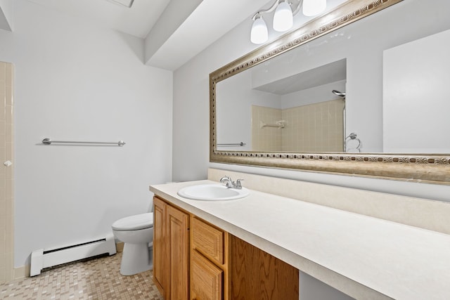 full bathroom featuring vanity, a baseboard heating unit, a tile shower, and toilet