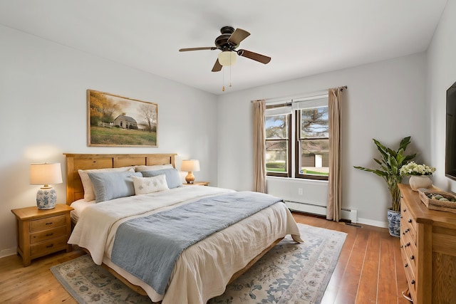 bedroom with baseboards, light wood-style flooring, and ceiling fan