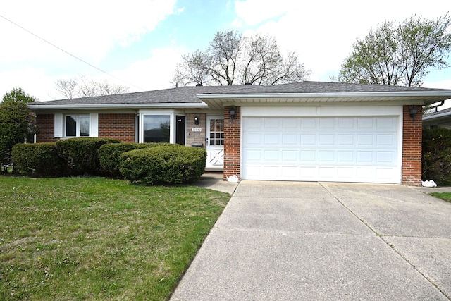 ranch-style home with brick siding, an attached garage, driveway, and a front lawn