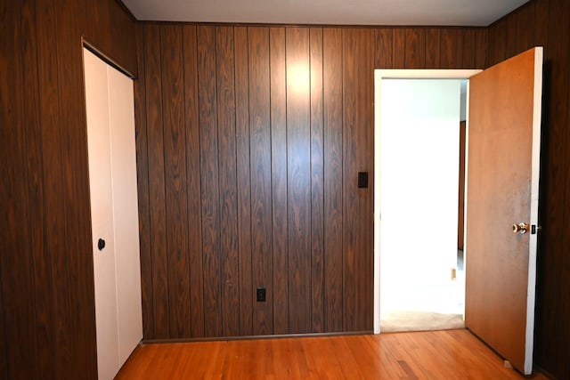 unfurnished bedroom with a closet and wood finished floors