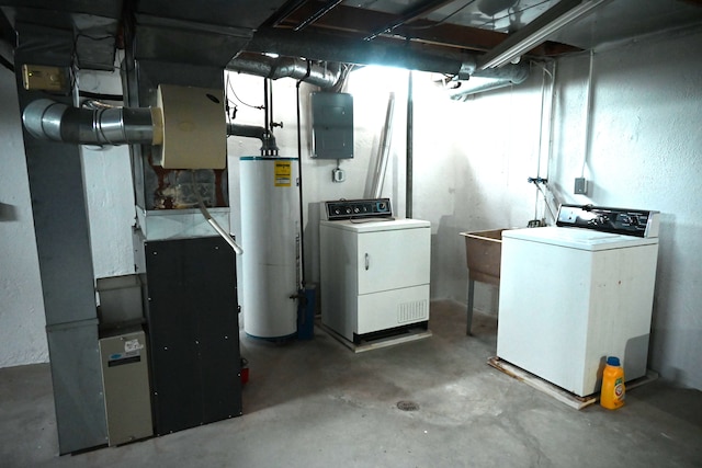 unfinished below grade area with heating unit, water heater, washing machine and dryer, and electric panel