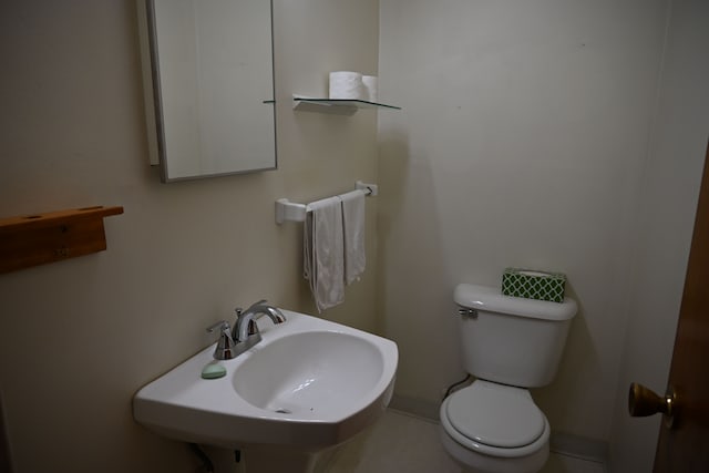 half bath with a sink and toilet