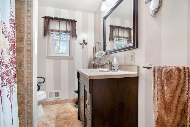 full bath with visible vents, curtained shower, vanity, tile patterned floors, and toilet