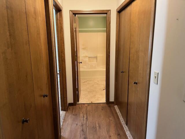 hall with wood finished floors