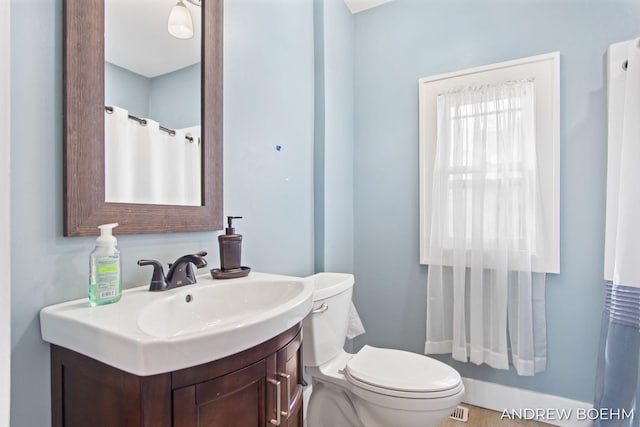 full bath with toilet, visible vents, and vanity