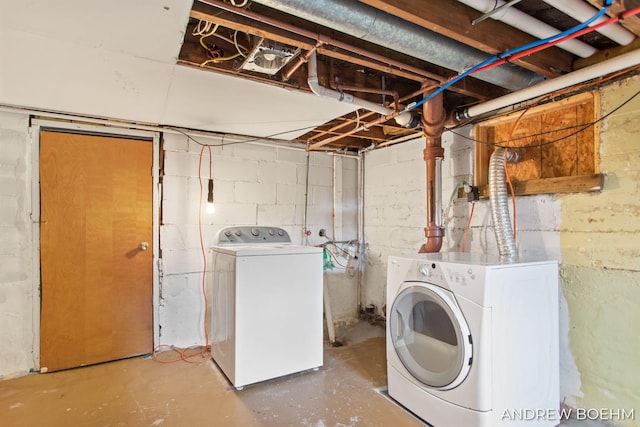 clothes washing area with washer and dryer and laundry area