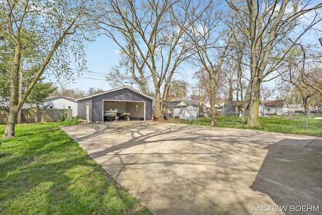 exterior space with fence and concrete driveway