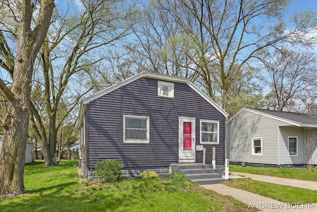 bungalow with a front lawn