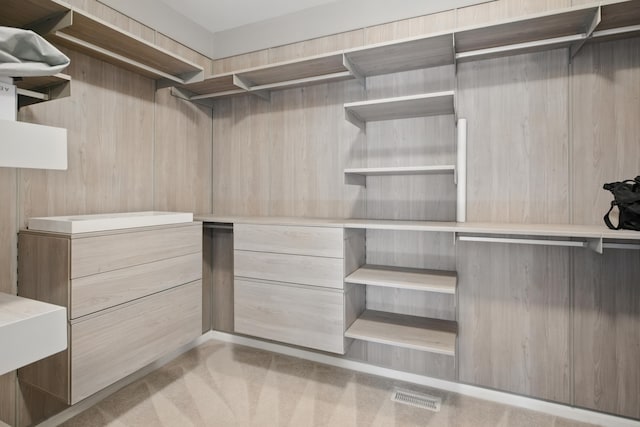 walk in closet with carpet flooring and visible vents